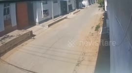 Road suddenly explodes as motorcycle rider approaches in China