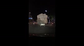 Dangerously overloaded tricycle seen carrying giant foam blocks on road in Vietnam