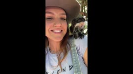 Mustachioed Monkeys Sit on Woman's Shoulders