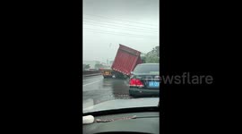 Powerful winds uproot truck and sweep away refrigerator as typhoon Talim makes landfall in southern China