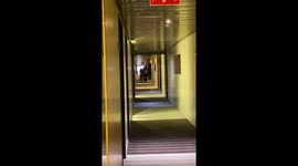Funny drunk couple caught stumbling around the hotel hall
