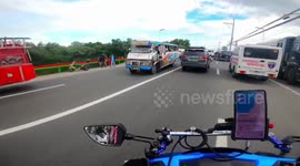 Passengers rescued when out-of-control mini bus plunges into lake in the Philippines