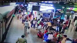 Woman loses balance while trying to get down moving train in central India