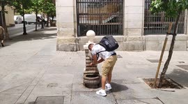 Heatwave in Europe: Residents and tourists refresh themselves in fountains in Madrid, Spain