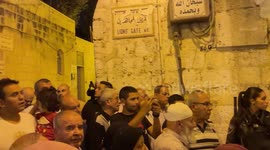 Palestinians argue with the Israeli forces that closed the road leading to the Lions' Gate during a settlers' march in the Old City of Jerusalem