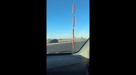 Resourceful man cooks hotdogs on car antenna while driving during Las Vegas heatwave