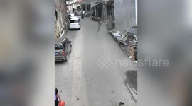 Quick-thinking pedestrian saves boy hurtling down hill on toy scooter in China