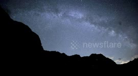 Bright milky way  4K timelapse in the swiss Alps with multiple satellites and some clouds