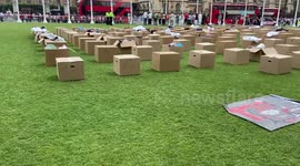 Shelter line Parliament Square with boxes of household items in support of tenant rights