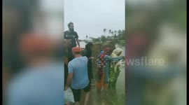 Rescue operation officials rescue locals stuck in flood-stricken area in western India
