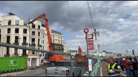 Crowds gather to watch Royal Albion Hotel demolition days after blaze