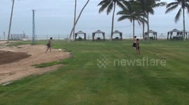 Plying football in rainy season close to Salalah beach  in Dhofar region of Oman
