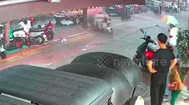 Driverless three-wheeler launches sudden rampage into multiple vehicles due to rain-triggered electrical malfunction