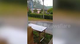 Locals scream when tent collapses during storm in Thailand