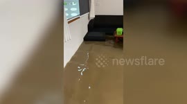 Living room flooded as heavy rain batters southern Thailand