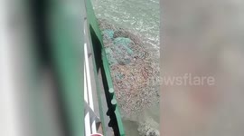 Dozens of tourists rescued from ferry stuck in nets for six hours