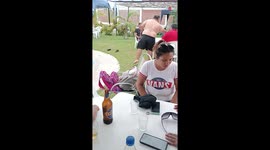 Man trying to step into a pool with a beer bottle & glass experiences a SHATTERING fail