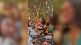 Supportive friends push-up girl's chest for DIY boob-job selfie