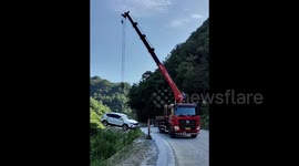 Car plunges into deep pit as driver forgets to pull handbrake in China