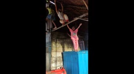 Children in Remote Areas, Boys and Girls Cheerfully Climbing and Hanging on a Wooden Hut