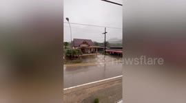 High floods submerge roads as monsoon rains batter southern Thailand
