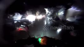 Motorcycle rider accidentally hits stray dog during stormy night