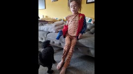 Little poodle helps young owner take clothes off 2