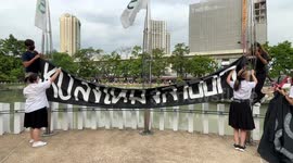 Protesters replace Thai flag with 'Respect My Vote' message