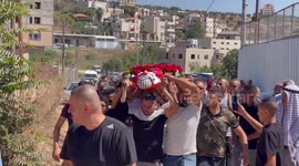 Mourners carry the body of Palestinian Mohammed al-Bayyed who was killed during clashes with Israeli forces while a protest against Israeli settlements during his funeral at Jalazoun refugee camp in the West Bank city of Ramallah
