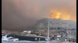 Wildfire on Greek island of Rhodes forces thousands of holidaymakers to flee homes and hotels