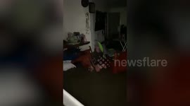 Heavy flood surges into home as Typhoon Talim batters northern Thailand