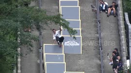 Parkour traceurs challenge 999-step course at China's Tianmen Mountain