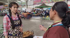 Attractive market seller, 22, becomes online hit with her good looks