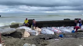 Typhoon Doksuri batters the Philippines as locals rush to reinforce sea wall