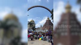 Roller coaster ride goes around hamster wheel at amusement park in Taiwan