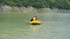 Child's body recovered amid relentless rain and rising water levels by rescuer in northern India