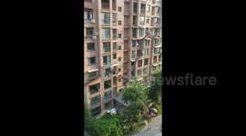 Brave neighbour saves girl dangling from third-floor window in southern China