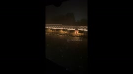 Hail storm on Garda lake of Italy at night