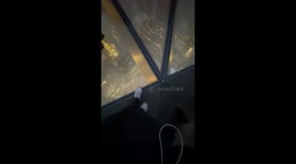 girl walking on the glass floor of