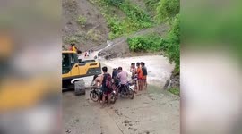 Motorcycles swept by strong current when river overflows due to Super Typhoon Doksuri