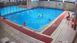 Hero lifeguard saves girl from drowning when she flips upside down in rubber ring