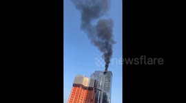 Crane catches fire on high-rise building in Manhattan