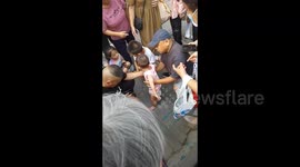 Heroic bus driver catches toddler falling from second floor of building in China