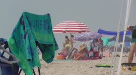 Thousands flock to beach as heatwave continues to scorch North Carolina