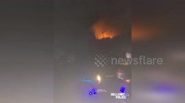 Cops Go Door-To-Door To Offer Locals Help With Raging Wildfires In Greece