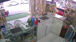 Wind blows over rack of phone cases as Typhoon Doksuri moves towards Thailand