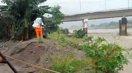 Police reclaim car swept away by river during Typhoon Doksuri