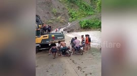 Motorcycles swept by river as it overflows due to Super Typhoon Doksuri