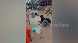 Snake charmer, 20, killed after cobra bites him on his nose as he tries to kiss it