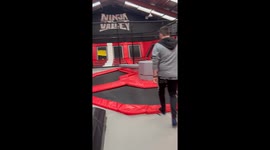 Boy gets knocked out in the trampoline dodge activity in a ninja trampoline valley